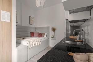 Posteľ alebo postele v izbe v ubytovaní HARBOR APARTMENTS - Damrota