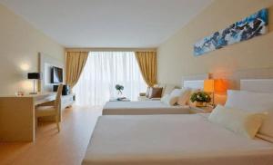 Ένα ή περισσότερα κρεβάτια σε δωμάτιο στο Jinhold Apartment Hotel