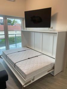 Posteľ alebo postele v izbe v ubytovaní Moonlight Apartment