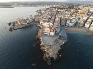 an aerial view of a town on the water at Can Nicasi in L'Escala