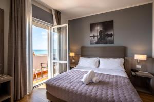 Postel nebo postele na pokoji v ubytování Hotel Loreley
