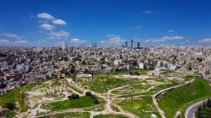 an aerial view of the city of tokyo with buildings at The Royal Luxury Superior Queen cot in Amman +12 photos