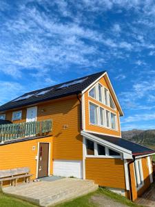 a house with solar panels on the roof at Stave Camping & Hot Pools in Stave