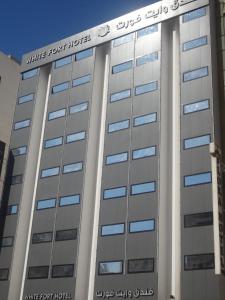 a building with the words white port hotel on it at White Fort Hotel in Dubai