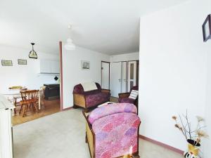 a living room with a couch and a table at Appartement Aix-les-Bains, 2 pièces, 2 personnes - FR-1-555-49 in Aix-les-Bains