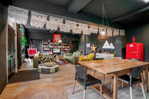 a living room with a table and chairs at The Colour House Lake District Escape for Two in Kendal