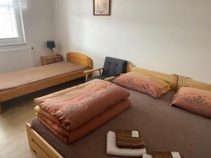 Postel nebo postele na pokoji v ubytování Rybářská restaurace a penzion u Horáků