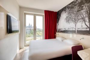 Postel nebo postele na pokoji v ubytování B&B HOTEL Antwerpen Zuid