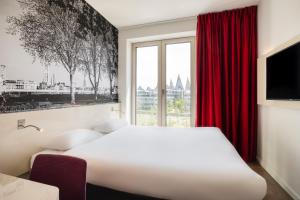 Postel nebo postele na pokoji v ubytování B&B HOTEL Antwerpen Zuid