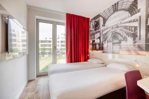Postel nebo postele na pokoji v ubytování B&B HOTEL Antwerpen Zuid