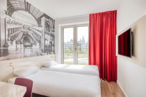 Postel nebo postele na pokoji v ubytování B&B HOTEL Antwerpen Zuid