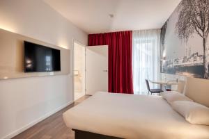 Postel nebo postele na pokoji v ubytování B&B HOTEL Antwerpen Zuid