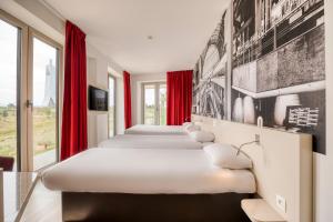 Postel nebo postele na pokoji v ubytování B&B HOTEL Antwerpen Zuid