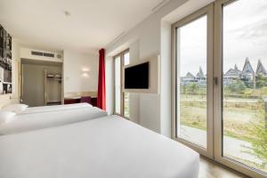Postel nebo postele na pokoji v ubytování B&B HOTEL Antwerpen Zuid
