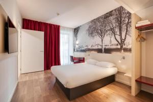 Postel nebo postele na pokoji v ubytování B&B HOTEL Antwerpen Zuid