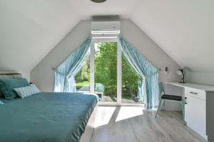 Postel nebo postele na pokoji v ubytování Domki z Pasją