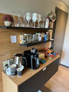 a counter with a coffee maker on top of it at Pension auf dem Land in Kevelaer