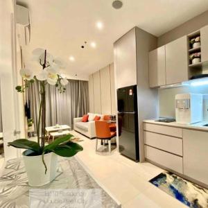 a kitchen and living room with a couch and a table at Hilton Hill10 Shah Alam in Shah Alam
