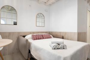 Posteľ alebo postele v izbe v ubytovaní Apartamento Cobarrubias