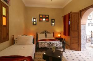 Llit o llits en una habitació de Riad Maissoun