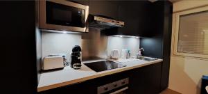 Kuchyň nebo kuchyňský kout v ubytování Appartements Barcelonette by PraLoup Vacances