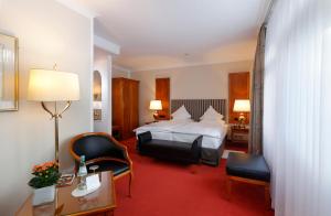 Postel nebo postele na pokoji v ubytování Romantik Hotel Gebhards