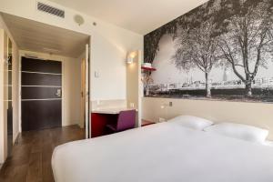Postel nebo postele na pokoji v ubytování B&B HOTEL Antwerpen Zuid