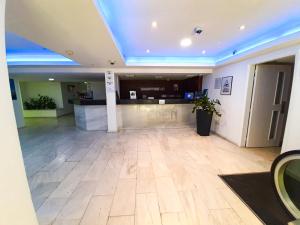an empty lobby with a reception desk in a building at Eden Sea Breeze, 1 bed, Rooftop Pool, Gym in Limassol
