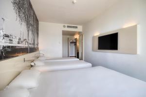Postel nebo postele na pokoji v ubytování B&B HOTEL Antwerpen Zuid