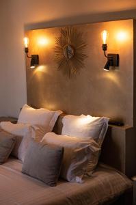 a bedroom with a large bed with white pillows at Ferme du Roy in Anserville