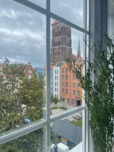 a view of a city from a window at Dluga 66 Attic in Gdańsk