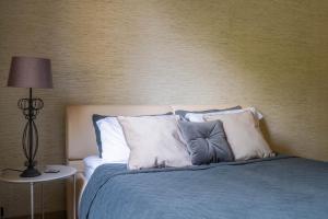 Postel nebo postele na pokoji v ubytování Remigija Studio Home + 25 fotografií