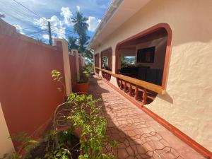 a balcony of a house with a walkway at Villa Milou in Baie Sainte Anne