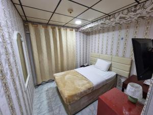 Postel nebo postele na pokoji v ubytování West Hotel