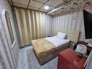 Postel nebo postele na pokoji v ubytování West Hotel