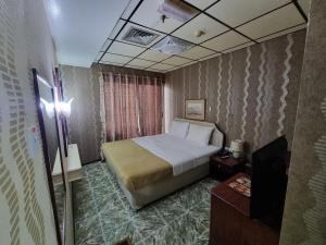 Postel nebo postele na pokoji v ubytování West Hotel