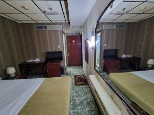 Postel nebo postele na pokoji v ubytování West Hotel