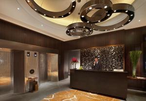 Uma televisão e/ou sistema de entretenimento em Hotel One Eighteen