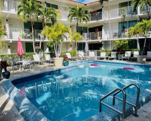 a large swimming pool in front of a hotel at Ocean Mile Hotel in Fort Lauderdale