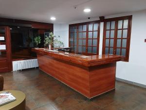 a large kitchen with a wooden counter top at Hotel Comapedrosa in Arinsal