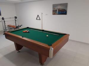a pool table with balls on it in a room at Villa BO in Koprivno