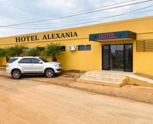 a car parked in front of a hotel albuquerque at Hotel Alexânia in Alexânia