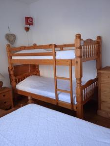a couple of bunk beds in a room at Le Sancy, appart T2, 4 pers, centre ville du Mont Dore in Le Mont-Dore