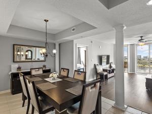 a dining room and living room with a table and chairs at North Tower #802 Condo in Myrtle Beach