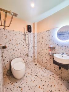 a bathroom with a toilet and a sink at Q apaz Serviced Apartment - 45TL in Ho Chi Minh City