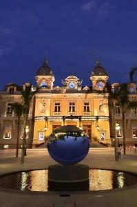 a building with a large blue bowl in front of it at SARA RIVIERA Costa Plana in Cap d'Ail