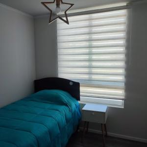 Rúm í herbergi á Ecobarrio I