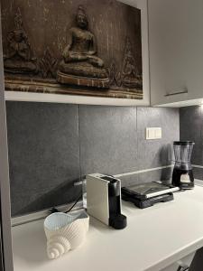 a kitchen counter with a toaster and a printer on it at Sea View Residence by MD in Alexandroupoli