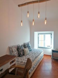 a living room with a couch and a table at A Casa Pequenina - Escusa, Marvão in Marvão