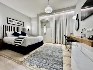 Postel nebo postele na pokoji v ubytování IONIAN SUITES by Bruskos